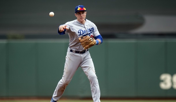 Apr 10, 2016; San Francisco, CA, USA; Los Angeles Dodgers second baseman Chase Utley (26) fields a ground ball and records the out at first base during the fourth inning against the San Francisco Giants at AT&T Park. Mandatory Credit: Kenny Karst-USA TODAY Sports