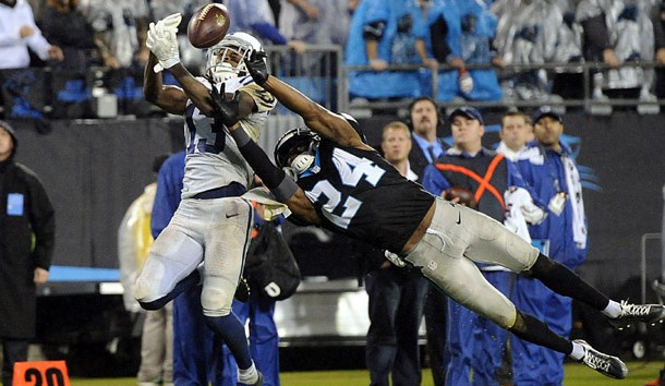 Nov 2, 2015; Charlotte, NC, USA; Indianapolis Colts wide receiver T.Y. Hilton (13) attempts to receive a pass as he is defended by Carolina Panthers cornerback Josh Norman (24) during the second half of the game at Bank of America Stadium. Carolina wins in overtime 29-26. Mandatory Credit: Sam Sharpe-USA TODAY Sports