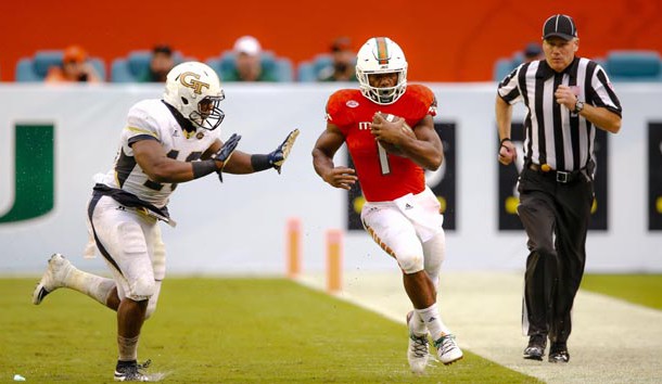 Nov 21, 2015; Miami Gardens, FL, USA; Georgia Tech Yellow Jackets linebacker P.J. Davis (40) pushes Miami Hurricanes running back Mark Walton (1) out of bounce during the second half at Sun Life Stadium. Mandatory Credit: Steve Mitchell-USA TODAY Sports