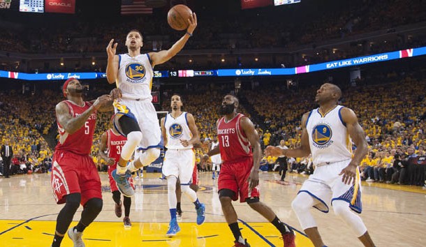 Steph Curry scores against the Rockets in Game 1 of the opening round of the 2016 NBA Playoffs. (Kyle Terada-USA TODAY Sports.) 