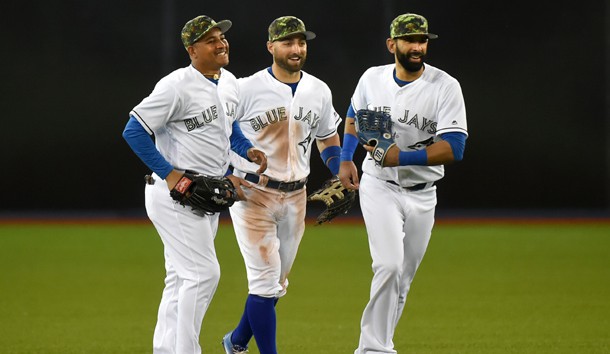 May 30, 2016; Toronto, Ontario, CAN; Toronto Blue Jays left fielder Ezequiel Carrera (3) and center fielder Kevin Pillar (11) and right fielder Jose Bautista (19) celebrate a 4-2 win over the New York Yankees at Rogers Centre. Mandatory Credit: Dan Hamilton-USA TODAY Sports