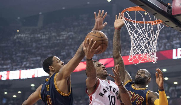 May 23, 2016; Toronto, Ontario, CAN; Toronto Raptors guard DeMar DeRozan (10) drives to the basket as Cleveland Cavaliers forward LeBron James (23) and forward Channing Frye (9) try to defend during the first quarter in game four of the Eastern conference finals of the NBA Playoffs at Air Canada Centre. Mandatory Credit: Nick Turchiaro-USA TODAY Sports