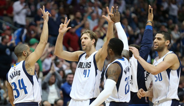 Mar 20, 2016; Dallas, TX, USA; Dallas Mavericks forward Dirk Nowitzki (41) celebrates with teammates after scoring a three point basket in overtime against the Portland Trail Blazers at American Airlines Center. The Mavs beat the Trail Blazers 132-120. Mandatory Credit: Matthew Emmons-USA TODAY Sports