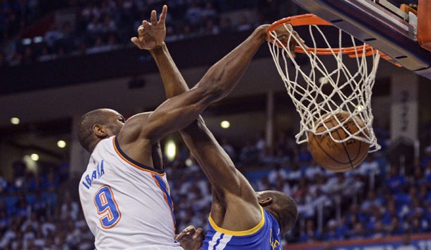 May 22, 2016; Oklahoma City, OK, USA; Oklahoma City Thunder forward Serge Ibaka (9) dunks over Golden State Warriors center Festus Ezeli (31) during the first quarter in game three of the Western conference finals of the NBA Playoffs at Chesapeake Energy Arena. Mandatory Credit: Mark D. Smith-USA TODAY Sports