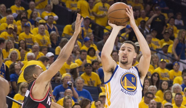 May 1, 2016; Oakland, CA, USA; Golden State Warriors guard Klay Thompson (11) shoots the basketball against Portland Trail Blazers guard C.J. McCollum (3) during the third quarter in game one of the second round of the NBA Playoffs at Oracle Arena. The Warriors defeated the Trail Blazers 118-106. Mandatory Credit: Kyle Terada-USA TODAY Sports
