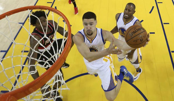 May 3, 2016; Oakland, CA, USA; Golden State Warriors guard Klay Thompson (11) goes up for a shot against Portland Trail Blazers center Ed Davis (17) during the first half in game two of the second round of the NBA Playoffs at Oracle Arena. The Warriors defeated the Trail Blazers 110-99. Mandatory Credit: Ezra Shaw-Pool Photo via USA TODAY Sports
