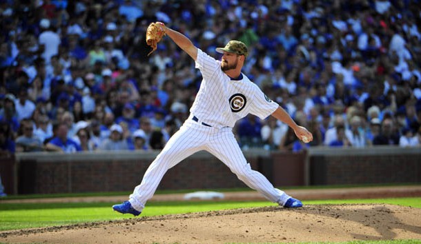 May 30, 2016; Chicago, IL, USA; Chicago Cubs relief pitcher Travis Wood (37) throws the ball against the Los Angeles Dodgers during the third inning at Wrigley Field. Mandatory Credit: David Banks-USA TODAY Sports