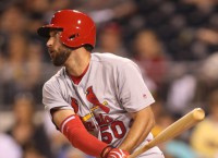 Cards erupt in 12th with help from Wainwright