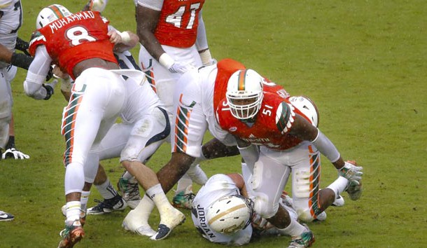 Nov 21, 2015; Miami Gardens, FL, USA; Miami Hurricanes linebacker Juwon Young (51) reacts after sacking Georgia Tech Yellow Jackets quarterback Matthew Jordan (11) during the second half at Sun Life Stadium. Photo Credit: Steve Mitchell-USA TODAY Sports