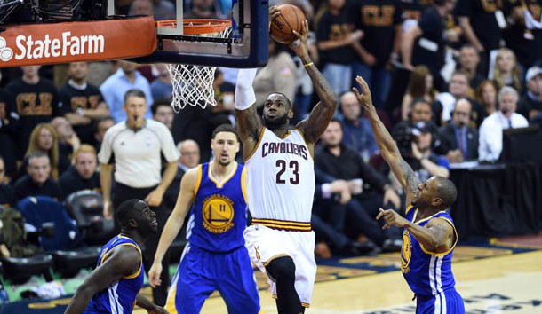 Jun 16, 2016; Cleveland, OH, USA; Cleveland Cavaliers forward LeBron James (23) dunks the ball against Golden State Warriors forward Andre Iguodala (9) and forward Draymond Green (23) during the third quarter in game six of the NBA Finals at Quicken Loans Arena. Mandatory Credit: Bob Donnan-USA TODAY Sports