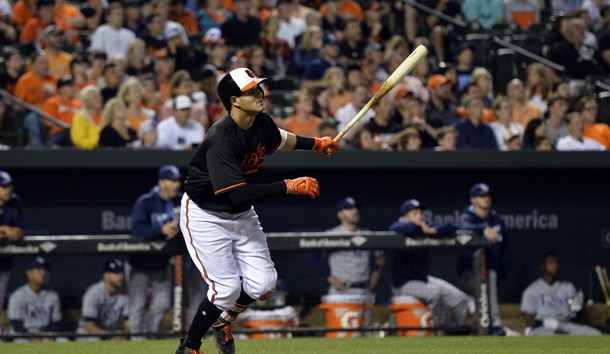Jun 24, 2016; Baltimore, MD, USA; Baltimore Orioles third baseman Manny Machado (13) hits a solo home run during the eighth inning against the Tampa Bay Rays at Oriole Park at Camden Yards. Baltimore Orioles defeated Tampa Bay Rays 6-3. Mandatory Credit: Tommy Gilligan-USA TODAY Sports