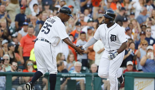 Jul 18, 2016; Detroit, MI, USA; Detroit Tigers left fielder Justin Upton (8) receives congratulations from third base coach Dave Clark (25) after he hit a home run in the second inning against the Minnesota Twins at Comerica Park. Photo Credit: Rick Osentoski-USA TODAY Sports