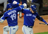 Bautista, Donaldson help Jays widen lead over O's