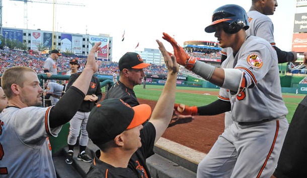 Aug 24, 2016; Washington, DC, USA;  Baltimore Orioles third baseman Manny Machado (13) is congratulated by teammates after hitting a two run homer against the Washington Nationals during the first inning at Nationals Park. Photo Credit: Brad Mills-USA TODAY Sports