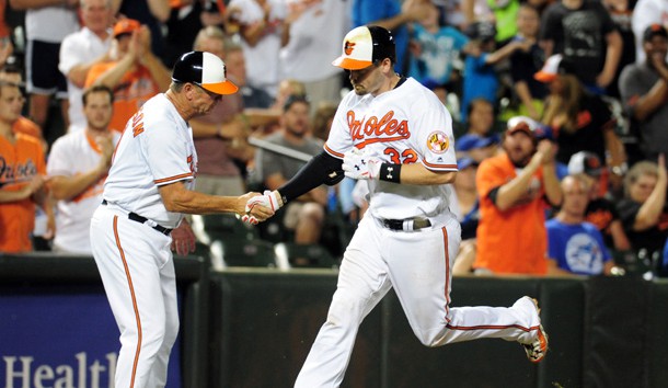 Aug 30, 2016; Baltimore, MD, USA; Baltimore Orioles catcher Matt Wieters (32) high fives third base coach Bobby Dickerson (11) after hitting a home run in the eighth inning against the Toronto Blue Jays at Oriole Park at Camden Yards. Photo Credit: Evan Habeeb-USA TODAY Sports