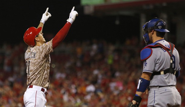 Aug 19, 2016; Cincinnati, OH, USA;  Cincinnati Reds relief pitcher Michael Lorenzen (21) reacts next to Los Angeles Dodgers catcher Yasmani Grandal (9) after Lorenzen hit his first career home run, a three-run home run, during the seventh inning at Great American Ball Park. The Reds won 9-2. Photo Credit: David Kohl-USA TODAY Sports