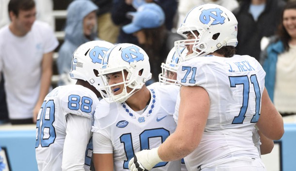 Sep 26, 2015; Chapel Hill, NC, USA; North Carolina Tar Heels quarterback Mitch Trubisky (10) celebrates in the end zone with wide receiver Jordan Fieulleteau (88) and offensive tackle Jon Heck (71) after throwing a touchdown pass to wide receiver Ryan Switzer (3) (not  pictured) in the fourth quarter. The Tar Heels defeated the Delaware Fightin Blue Hens 41-14 at Kenan Memorial Stadium. Photo Credit: Bob Donnan-USA TODAY Sports