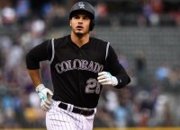 Rockies stay hot, roll to 12-2 win over Dodgers