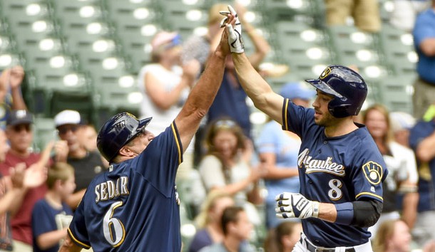 Aug 24, 2016; Milwaukee, WI, USA;  Milwaukee Brewers left fielder Ryan Braun (8) is greeted by third base coach Ed Sedar after hitting a solo home run in the fourth inning during the game against the Colorado Rockies at Miller Park. Photo Credit: Benny Sieu-USA TODAY Sports