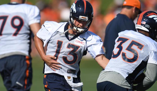Jul 28, 2016; Englewood, CO, USA; Denver Broncos quarterback Trevor Siemian (13) hands off the ball to running back Kapri Bibbs (35) during training camp drills held at the UCHealth Training Center. Photo Credit: Ron Chenoy-USA TODAY Sports