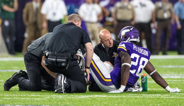 Sep 18, 2016; Minneapolis, MN, USA; Minnesota Vikings running back Adrian Peterson (28) is injured during the third quarter against the Green Bay Packers at U.S. Bank Stadium. The Vikings defeated the Packers 17-14. Photo Credit: Brace Hemmelgarn-USA TODAY Sports