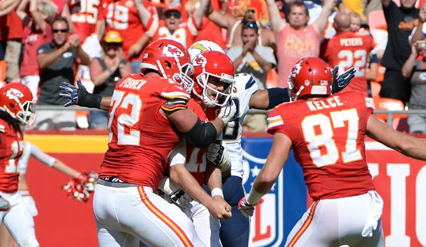 Sep 11, 2016; Kansas City, MO, USA; Kansas City Chiefs quarterback Alex Smith (11) is congratulated after scoring the winning touchdown in overtime against the San Diego Chargers at Arrowhead Stadium. Kansas City won 33-27. John Credit: John Rieger-USA TODAY Sports