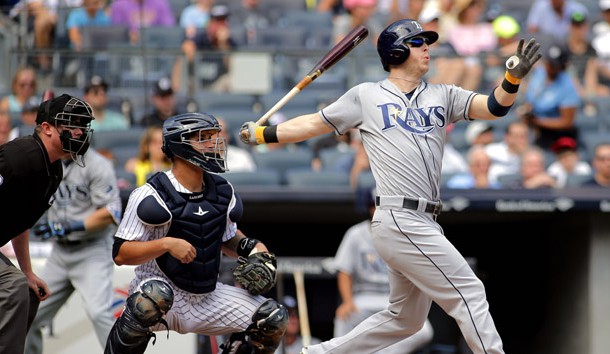 Sep 11, 2016; Bronx, NY, USA; Tampa Bay Rays designated hitter Corey Dickerson (10) hits a two run home run against the New York Yankees during the second inning at Yankee Stadium. Mandatory Credit: Andy Marlin-USA TODAY Sports