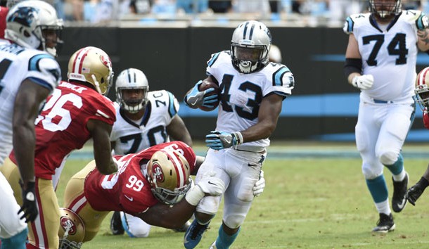 Sep 18, 2016; Charlotte, NC, USA;  Carolina Panthers running back Fozzy Whittaker (43) runs as San Francisco 49ers defensive end DeForest Buckner (99) defends in the second quarter at Bank of America Stadium. Photo Credit: Bob Donnan-USA TODAY Sports