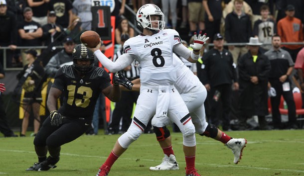 Sep 10, 2016; West Lafayette, IN, USA;  Cincinnati Bearcats quarterback Hayden Moore (8) leans back to throw as Purdue Boilermakers defensive end Gelen Robinson (13) closes in at Ross Ade Stadium. Photo Credit: Sandra Dukes-USA TODAY Sports