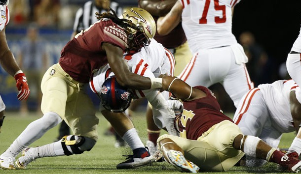 Sep 5, 2016; Orlando, FL, USA; Florida State Seminoles defensive end DeMarcus Walker (44) and defensive end Josh Sweat (9) tackle Mississippi Rebels quarterback Chad Kelly (middle) for a sack in the fourth quarter  at Camping World Stadium. Florida State Seminoles won 45-34. Photo Credit: Logan Bowles-USA TODAY Sports