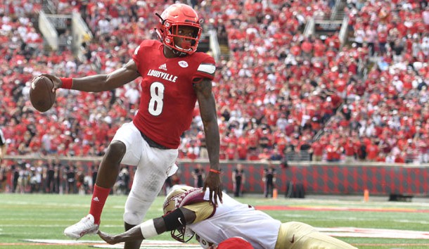 Sep 17, 2016; Louisville, KY, USA;  Louisville Cardinals quarterback Lamar Jackson (8) avoids the tackle of Florida State Seminoles linebacker Dontavious Jackson (5) during the second quarter at Papa John's Cardinal Stadium. Photo Credit: Jamie Rhodes-USA TODAY Sports