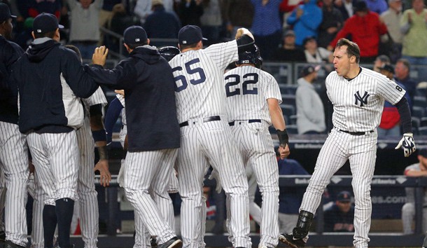 Sep 28, 2016; Bronx, NY, USA; New York Yankees first baseman Mark Teixeira (25) celebrates with teammates after hitting a walk off grand slam against the Boston Red Sox during the ninth inning at Yankee Stadium. Photo Credit: Brad Penner-USA TODAY Sports