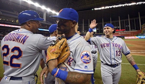 Sep 28, 2016; Miami, FL, USA; New York Mets first base coach Tom Goodwin (left) and third baseman Jose Reyes (center) and shortstop Asdrubal Cabrera (right) celebrate their 5-2 win over the Miami Marlins  the at Marlins Park. Photo Credit: Steve Mitchell-USA TODAY Sports
