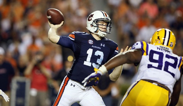 Sep 24, 2016; Auburn, AL, USA;  Auburn Tigers quarterback Sean White (13) looks for a receiver as LSU Tigers lineman Lewis Neal (92) closes in during the third quarter at Jordan Hare Stadium.  The Auburn Tigers beat the LSU Tigers 18-13. Photo Credit: John Reed-USA TODAY Sports