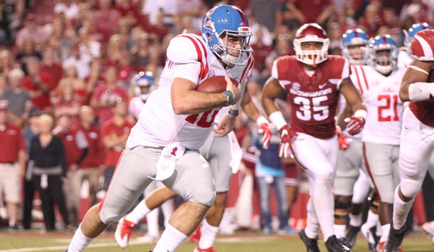 Oct 15, 2016; Fayetteville, AR, USA;  Ole Miss Rebels quarterback Chad Kelly (10) rushes for a touchdown in the second quarter against the Arkansas Razorbacks at Donald W. Reynolds Razorback Stadium. Photo Credit: Nelson Chenault-USA TODAY Sports