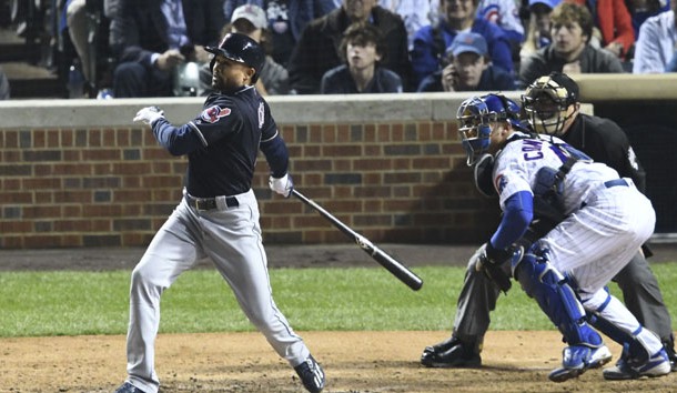 Oct 28, 2016; Chicago, IL, USA; Cleveland Indians left fielder Coco Crisp (left) hits a RBI-single scoring pinch-runner Michael Martinez (not pictured) in front of Chicago Cubs catcher Willson Contreras (right) during the seventh inning in game three of the 2016 World Series at Wrigley Field. Photo Credit: Jerry Lai-USA TODAY Sports