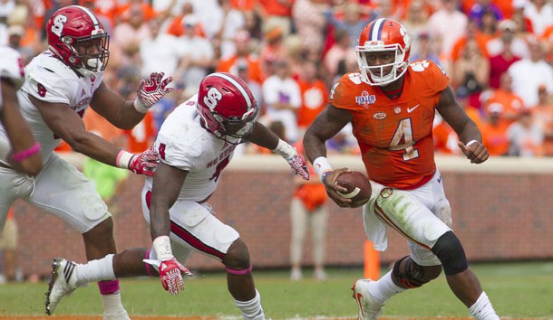 Oct 15, 2016; Clemson, SC, USA; Clemson Tigers quarterback Deshaun Watson (4) carries the ball while being defended by North Carolina State Wolfpack linebacker Jerod Fernandez (4) during the second half at Clemson Memorial Stadium. Tigers won 24-17. Photo Credit: Joshua S. Kelly-USA TODAY Sports