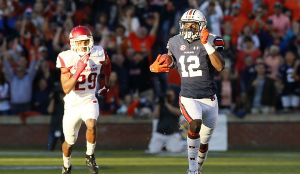 Oct 22, 2016; Auburn, AL, USA;  Auburn Tigers receiver Eli Stove (12) gets past Arkansas Razorbacks defensive back Jared Collins (29) and scores a touchdown during the first quarter at Jordan Hare Stadium. Photo Credit: John Reed-USA TODAY Sports