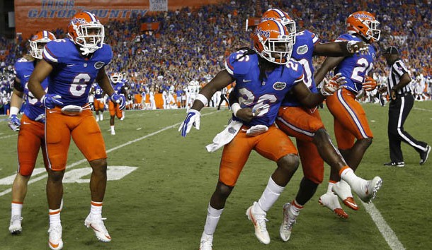 Sep 17, 2016; Gainesville, FL, USA; Florida Gators defensive back Marcell Harris (26) is congratulated after he intercepted the ball against the North Texas Mean Green   during the second quarter at Ben Hill Griffin Stadium. Photo Credit: Kim Klement-USA TODAY Sports
