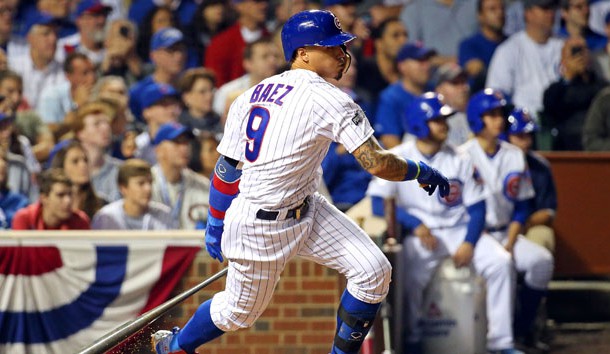 Oct 16, 2016; Chicago, IL, USA; Chicago Cubs second baseman Javier Baez (9) hits a single during the fifth inning against the Los Angeles Dodgers in game two of the 2016 NLCS playoff baseball series at Wrigley Field. Photo Credit: Jerry Lai-USA TODAY Sports