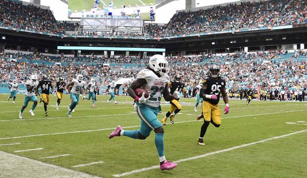 Oct 16, 2016; Miami Gardens, FL, USA; Miami Dolphins running back Jay Ajayi (23) runs past Pittsburgh Steelers outside linebacker Jarvis Jones (95) for a touchdown during the second half at Hard Rock Stadium. The Dolphins won 30-15. Photo Credit: Steve Mitchell-USA TODAY Sports