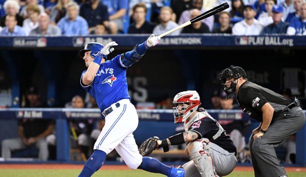 Oct 18, 2016; Toronto, Ontario, CAN; Toronto Blue Jays third baseman Josh Donaldson (20) hits a solo home run during the third inning against the Cleveland Indians in game four of the 2016 ALCS playoff baseball series at Rogers Centre. Photo Credit: Nick Turchiaro-USA TODAY Sports