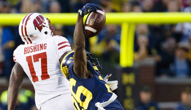 Oct 1, 2016; Ann Arbor, MI, USA; Michigan Wolverines cornerback Jourdan Lewis (26) intercepts a pass intended for Wisconsin Badgers wide receiver George Rushing (17) in the fourth quarter at Michigan Stadium. Michigan won 14-7. Photo Credit: Rick Osentoski-USA TODAY Sports