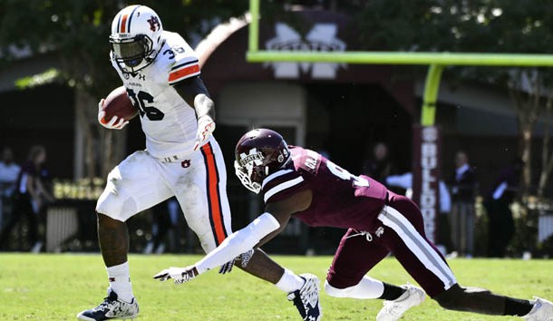 Oct 8, 2016; Starkville, MS, USA; Auburn Tigers running back Kamryn Pettway (36) runs the ball as he is defended by Mississippi State Bulldogs defensive back Jamoral Graham (9) during the second quarter of the game at Davis Wade Stadium. Photo Credit: Matt Bush-USA TODAY Sports