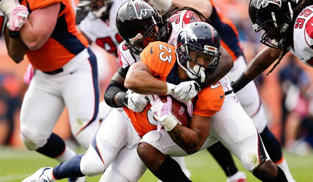 Oct 9, 2016; Denver, CO, USA; Denver Broncos running back Devontae Booker (23) is tackled by Atlanta Falcons strong safety Kemal Ishmael (36) in the second quarter at Sports Authority Field at Mile High. Photo Credit: Isaiah J. Downing-USA TODAY Sports
