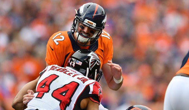 Oct 9, 2016; Denver, CO, USA; Denver Broncos quarterback Paxton Lynch (12) is sacked by Atlanta Falcons outside linebacker Vic Beasley (44) in the second half at Sports Authority Field at Mile High. The Falcons defeated the Broncos 23-16. Photo Credit: Ron Chenoy-USA TODAY Sports