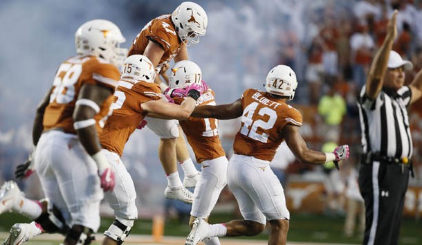 Oct 29, 2016; Austin, TX, USA; Texas Longhorns players celebrate with Trent Domingue (17) celebrates with teammates after his game-winning field goal to defend the Baylor Bears 35-34 at Darrell K Royal-Texas Memorial Stadium. Photo Credit: Erich Schlegel-USA TODAY Sports