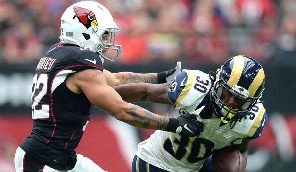 Oct 2, 2016; Glendale, AZ, USA; Arizona Cardinals free safety Tyrann Mathieu (32) attempts to tackle Los Angeles Rams running back Todd Gurley (30) during the second half at University of Phoenix Stadium. The Rams won 17-13. Photo Credit: Joe Camporeale-USA TODAY Sports