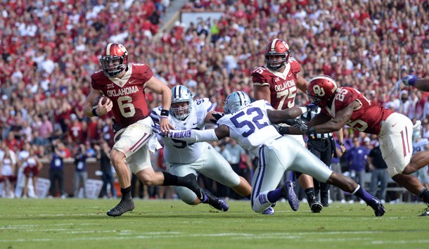Oct 15, 2016; Norman, OK, USA; Oklahoma Sooners quarterback Baker Mayfield (6) eludes a tackle attempt by Kansas State Wildcats linebacker Charmeachealle Moore (52) during the first quarter at Gaylord Family - Oklahoma Memorial Stadium. Photo Credit: Mark D. Smith-USA TODAY Sports