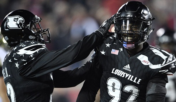 Nov 12, 2016; Louisville, KY, USA;  Louisville Cardinals safety Chucky Williams (22) congratulates linebacker Devonte Fields (92) for a sack against the Wake Forest Demon Deacons during the second half at Papa John's Cardinal Stadium. Louisville defeated Wake Forest 44-12.  Photo Credit: Jamie Rhodes-USA TODAY Sports